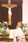 Father Paul Wickens elevates the Most Blessed Sacrament for veneration