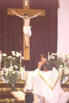 Father Paul Wickens elevating the Chalice
